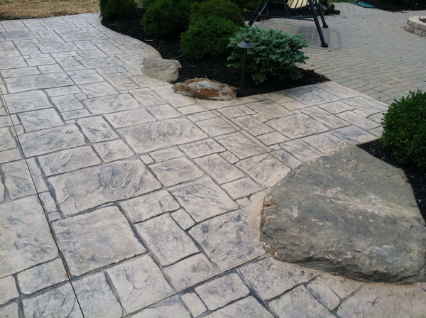 Pattern Concrete Patio with Rock Croppings